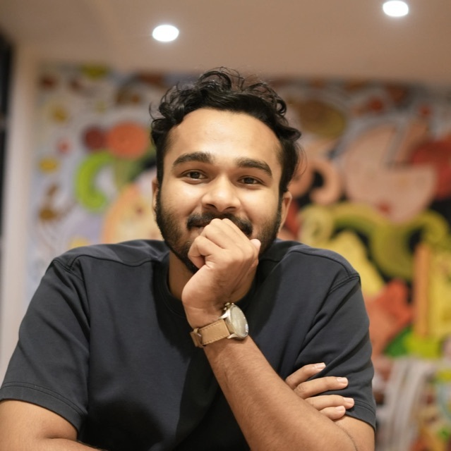 Muhammed Ziyad T V, founder of ZikkLabs, smiling with chin resting on hand
